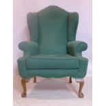 A Georgian style wing back armchair