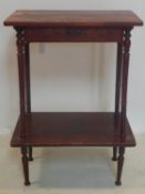 A 20th century Japanese red lacquered 2 tier side table, with single drawer, painted with flora