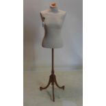 A modern mannequin on 19th century mahogany base