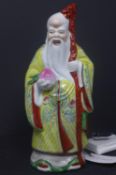 A Chinese Republican porcelain figure of Shou Lao, with marks to base, H.22cm