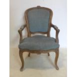 An early 20th century French walnut child's fauteuil