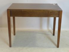 An oak writing table, with single drawer, stamped AM to base, raised on tapering chamfered legs, H.