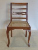 A walnut chair with cane seat bearing label for 'Celton Paris'