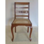 A walnut chair with cane seat bearing label for 'Celton Paris'