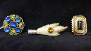 A Scottish silver lucky paw brooch together with a vintage Gil D'Agena gilt metal brooch set with