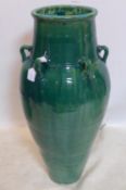 A large Persian green glazed Sharab wine vessel, H.90cm