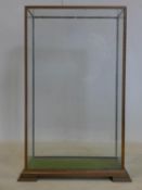 A 20th century glazed display case, on bracket feet, H.62 W.40 D.24cm