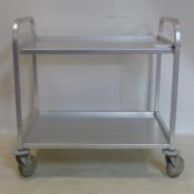 A 20th century aluminium drinks trolley, raised on castors, H.88 W.85 D.57cm