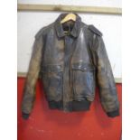 A vintage brown leather flight jacket