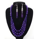 An Amethyst beaded necklace, together with a pair of amethyst earrings