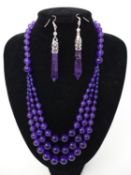 An Amethyst beaded necklace, together with a pair of amethyst earrings