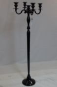 A contemporary floor standing black painted metal candelabra, H.155cm