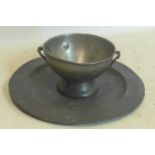 An antique pewter charger with various makers stamps, D.42cm, together with a French pewter tureen
