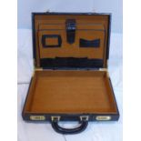 A vintage faux crocodile skin leather briefcase