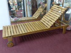 A teak sun lounger