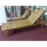 A teak sun lounger