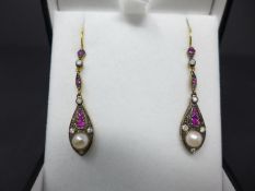 A pair of drop earrings set with rubies, diamonds and pearls, boxed