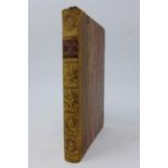 An 1870 edition of Pride & Prejudice by Jane Austen, Tauchnitz edition vol 1112, brown leather
