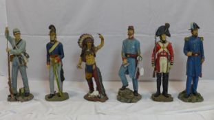 Six large resin figures of soldiers and a native American