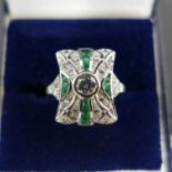 An Art Deco style silver, cubic zirconia and emerald ring, size P