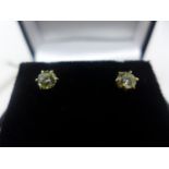 A pair of 18ct yellow gold and solitaire diamond stud earrings, 0.57ct