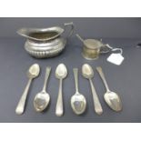 A collection of silver teaspoons, with makers mark 'CH', together with a mustard pot with blue glass