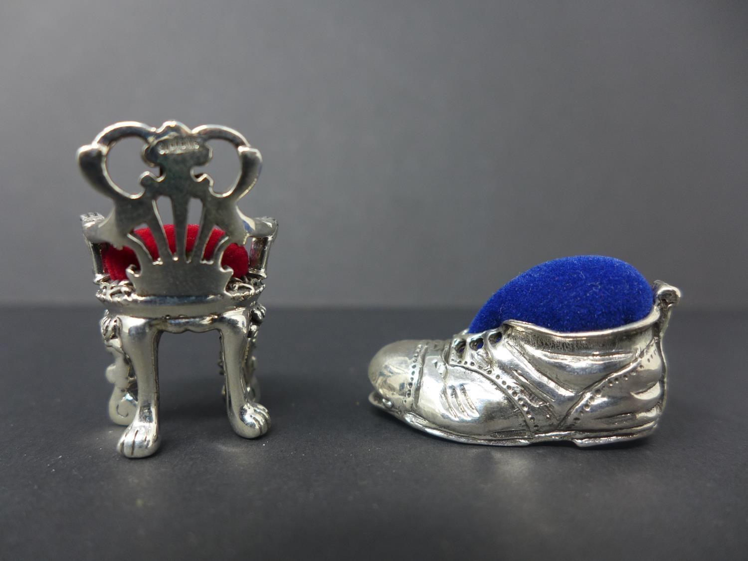 Two white metal pin cushions, one in the form of a shoe, H.1.7 W.3 D.1.7cm, and one in the form of - Image 2 of 2