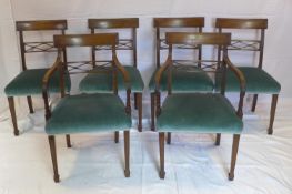 A set of 6 Regency style mahogany dining chairs, to include 2 carvers, newly upholstered with blue