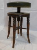 A 19th century mahogany adjustable stool, with studded green leather seat raised on splayed legs