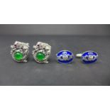 Two pairs of silver cufflinks, to include one set modelled as dragons set centrally with emeralds