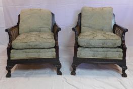 A pair of Edwardian mahogany bergere armchairs in the Chippendale manner