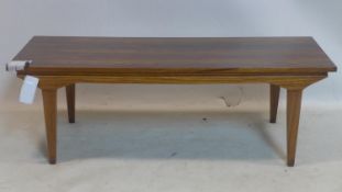 A 20th century Exotic hardwood coffee table, H.36 W.106 D.41cm