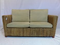 A rattan conservatory sofa with cushions, H.83 W.161 D.82cm