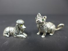 Two sterling silver animals, to include a cat, H.2.3 W.4.5cm, and a poodle, H.1.8 W.3cm