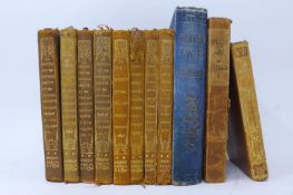 A collection of 11 antique books to include valley of the moon by Jack London, Oliver Twist, The