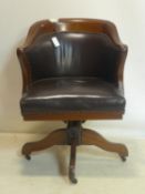 A late 19th/early 20th century Globe Wernicke mahogany captains swivel desk chair