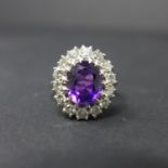A 14ct white gold, amethyst and diamond cluster ring, approx. 1.5ct total, boxed