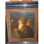 A 19th century study of a man and woman by candle light, oil on metal panel, in ebonized frame, 20 x