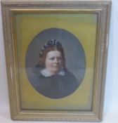 A Victorian portrait of an elderly lady, feigned to oval, oil on paper laid down, in giltwood frame,