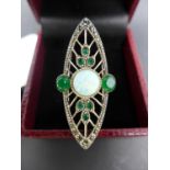An Art Deco style white metal ring with opalite panel and emerald surround, size Q