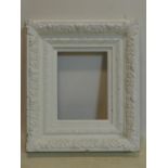 A white painted ornate picture frame, 78 x 66cm