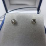 A pair of platinum and diamond stud earrings, 0.30ct