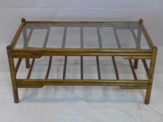 A 20th century bamboo coffee table with glass top, H.46 W.96 D.51cm