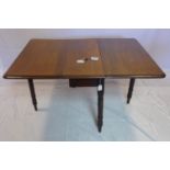 A 19th century mahogany drop leaf dining table, raised on turned legs, H.69 W.134 D.97cm