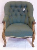 A Victorian rosewood spoon back armchair with button back upholstery, raised on cabriole legs