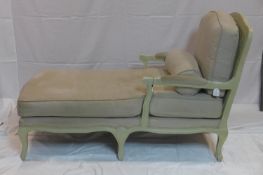 A 20th century grey painted chaise longue, with double caning to back and scroll arms, raised on