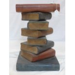 A lamp table modelled as a stack of books, H.51 W.33 D.34cm