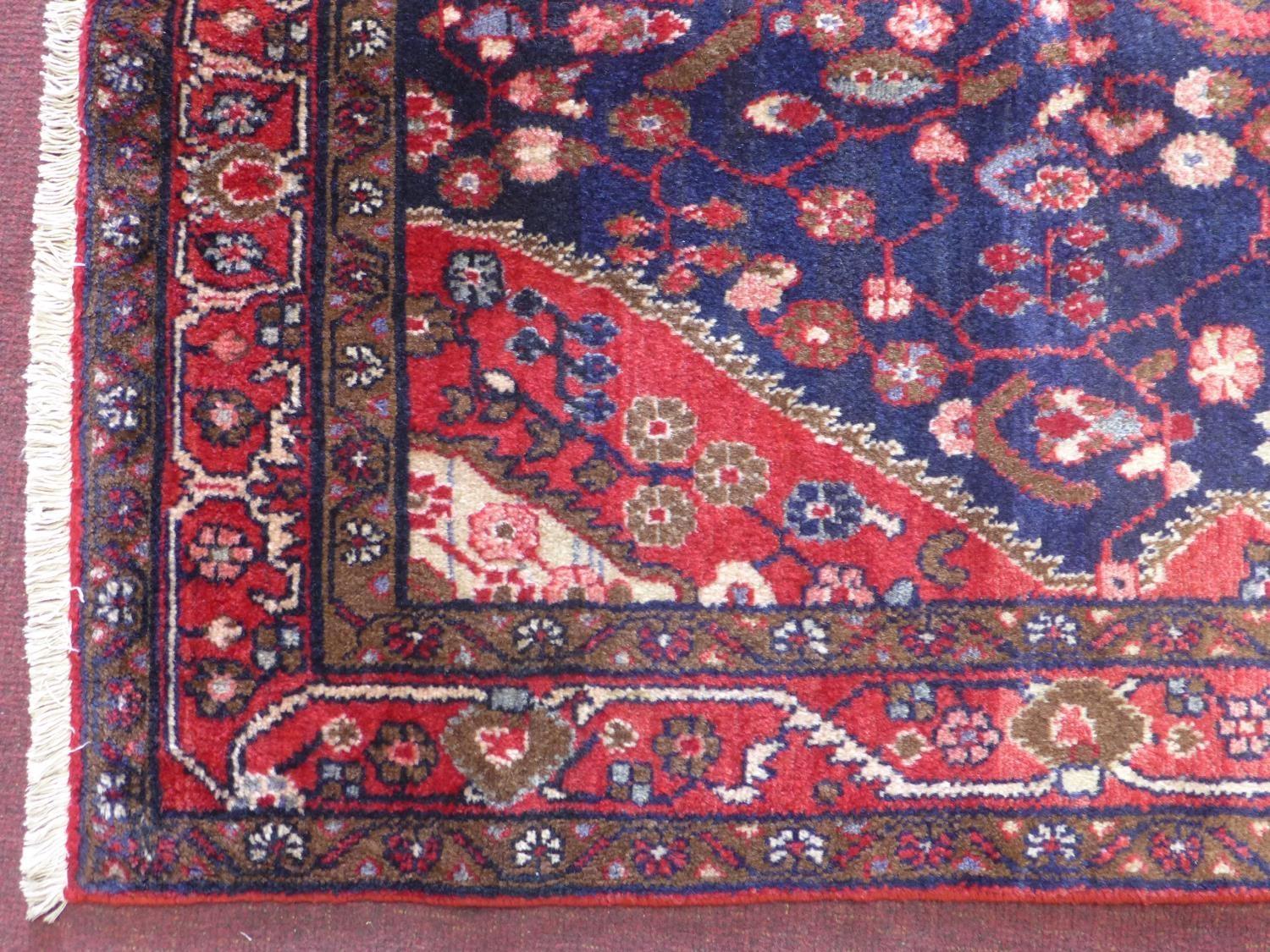 A North-West Persian Nahawand rug, central double pendent medallion with repeating petal motifs on a - Image 2 of 3