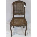 A 19th century French oak chair with cane seat and back rest