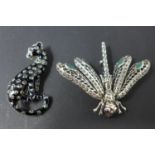 Two white metal brooches, to include one modelled as a leopard, H.5 W.2.5cm; the other modelled as a